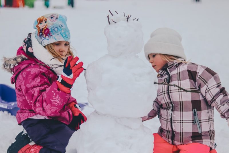 snow jacket-girl making snowman