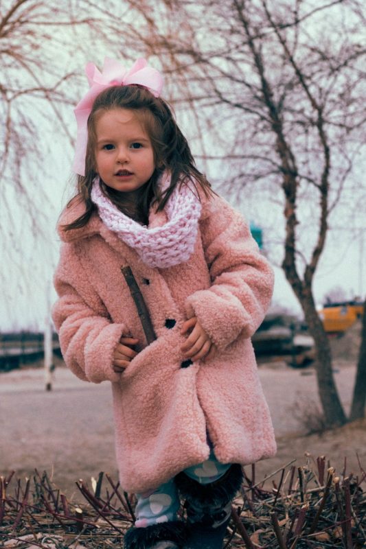 baby girl in pink jacket