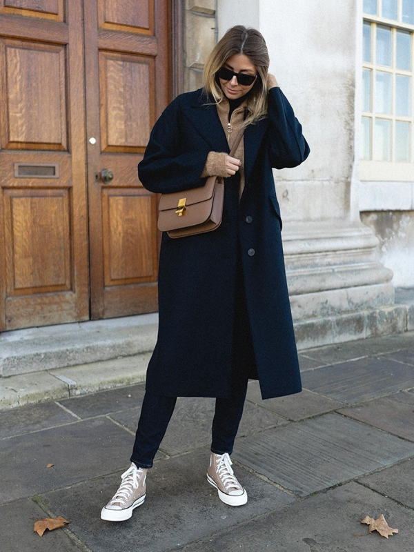 woman in a black woolen coat