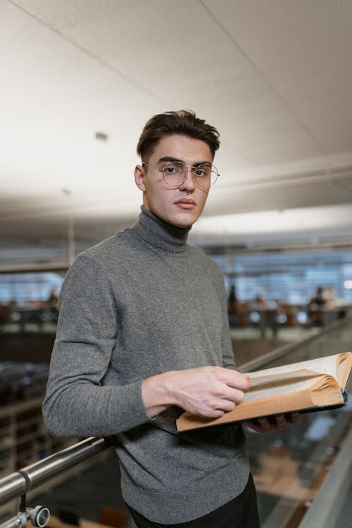 man in a grey turtleneck