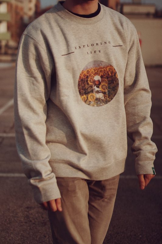 man in a crewneck sweatshirt