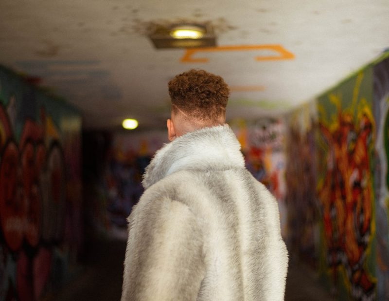 man wearing a fur coat