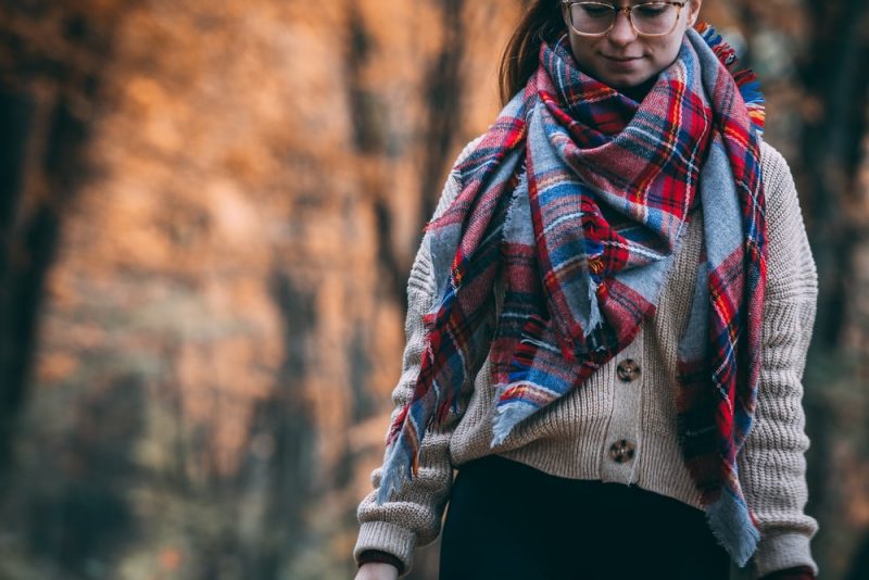 woman wearing a plaid scarf