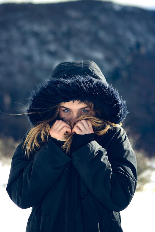 man in a blue winter coat