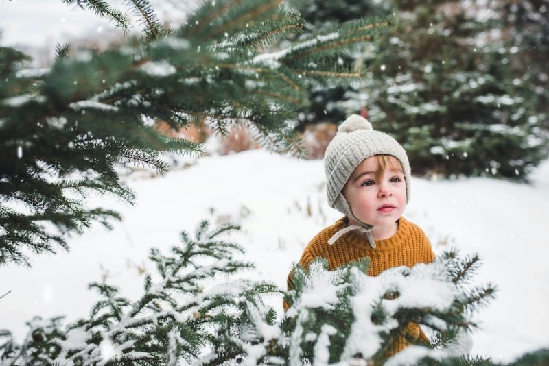 kid in a beanie and warm winter clothes