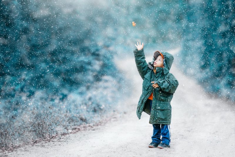 kid wearing layered warm winter clothes