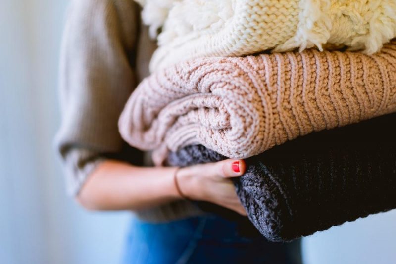 lady carrying wnter clothes