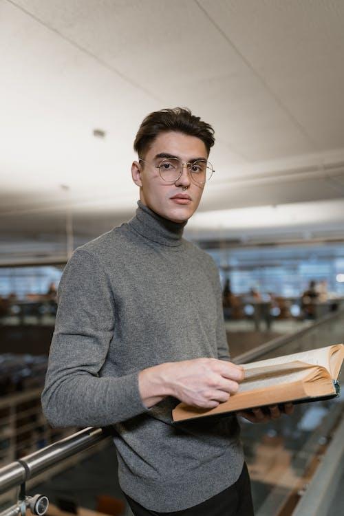 man wearing a grey-coloured turtleneck