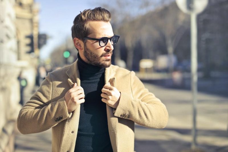 man wearing a turtleneck under a blazer