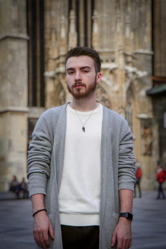 man in a cardigan for winter date night outfits